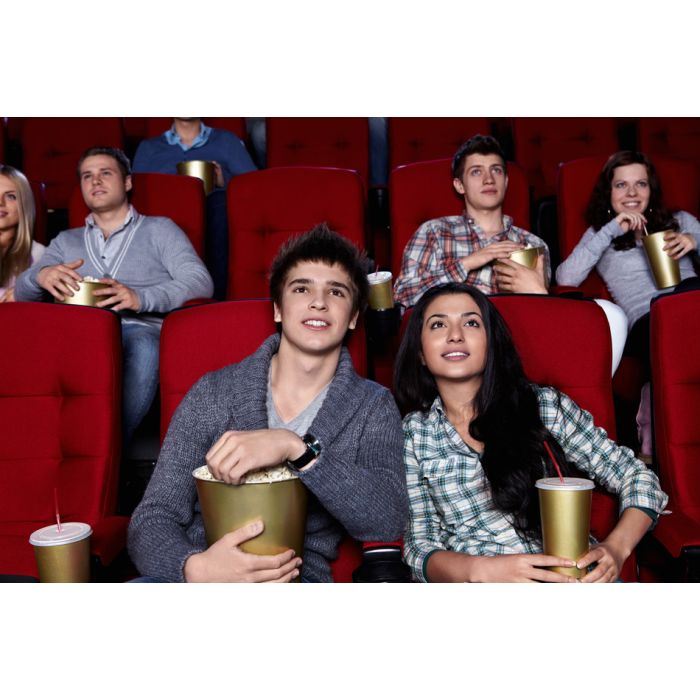 Young People Watching A Movie At The Cinema - ID # 31434729