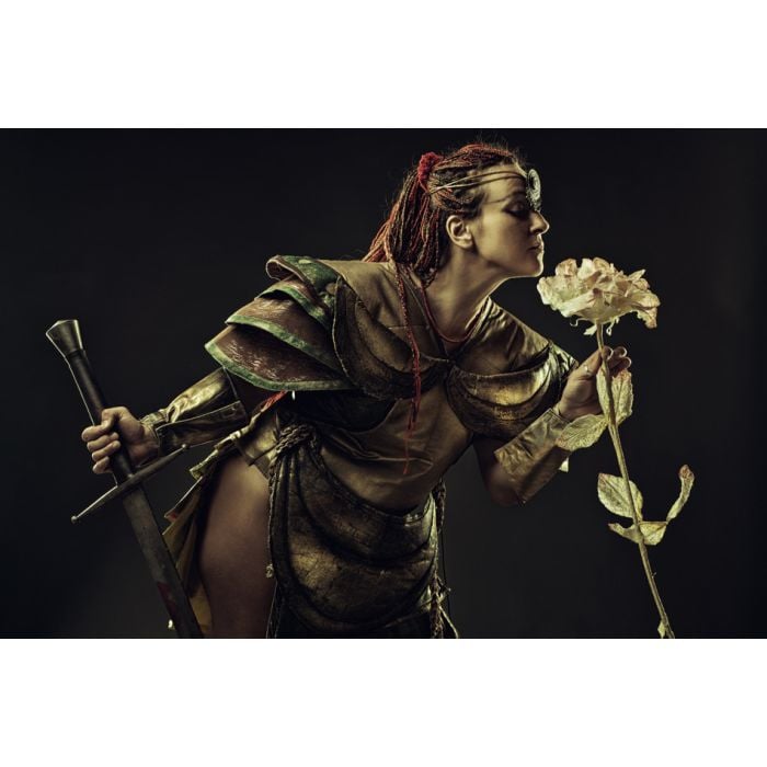 Barbarian Warrior With Sword Smelling A Rose - ID # 56364268