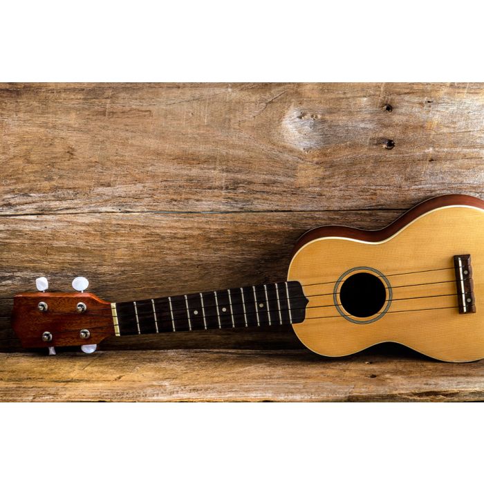 Ukulele Against A Wooden Background - ID # 60259942