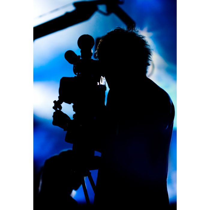 Silhouette Of A Cameraman Filming Fashion Show - ID # 7904636