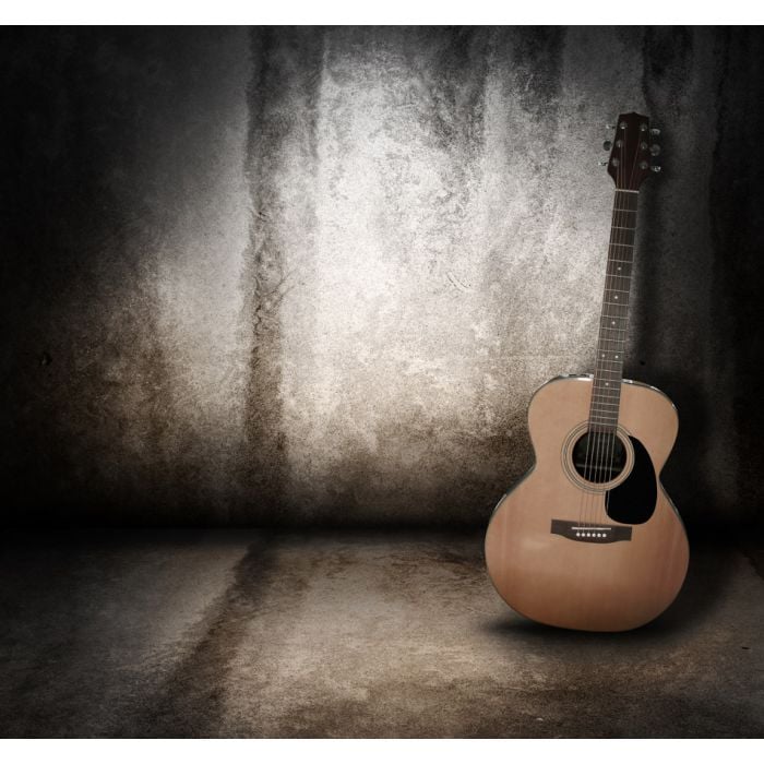 Wooden acoustic guitar on grunge textured wall - ID # 103820699