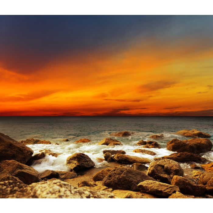 Red sky over a rocky seashore  - ID # 109387061