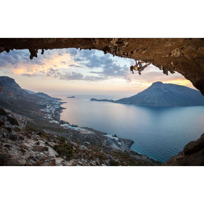 Female rock climber against picturesque view of Telendos - ID # 171850958