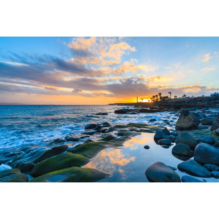 Sunset over ocean in Playa Blanca on Lanzarote island Spain - ID # 245152378