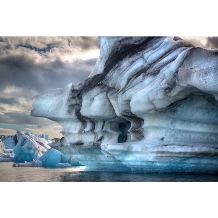 Reflections in Jokulsarlon lagoon in Iceland by sunset - ID # 246846106