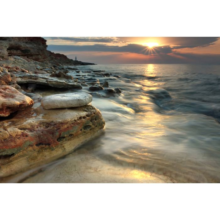 Beautiful rocky sea beach at the sunset in the summer - ID # 98645204