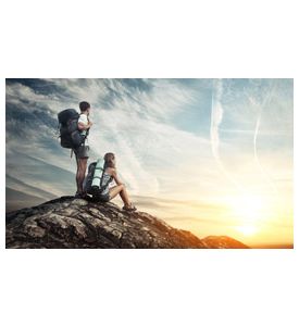 Two tourists with backpacks enjoying sunset  - ID # 115800856